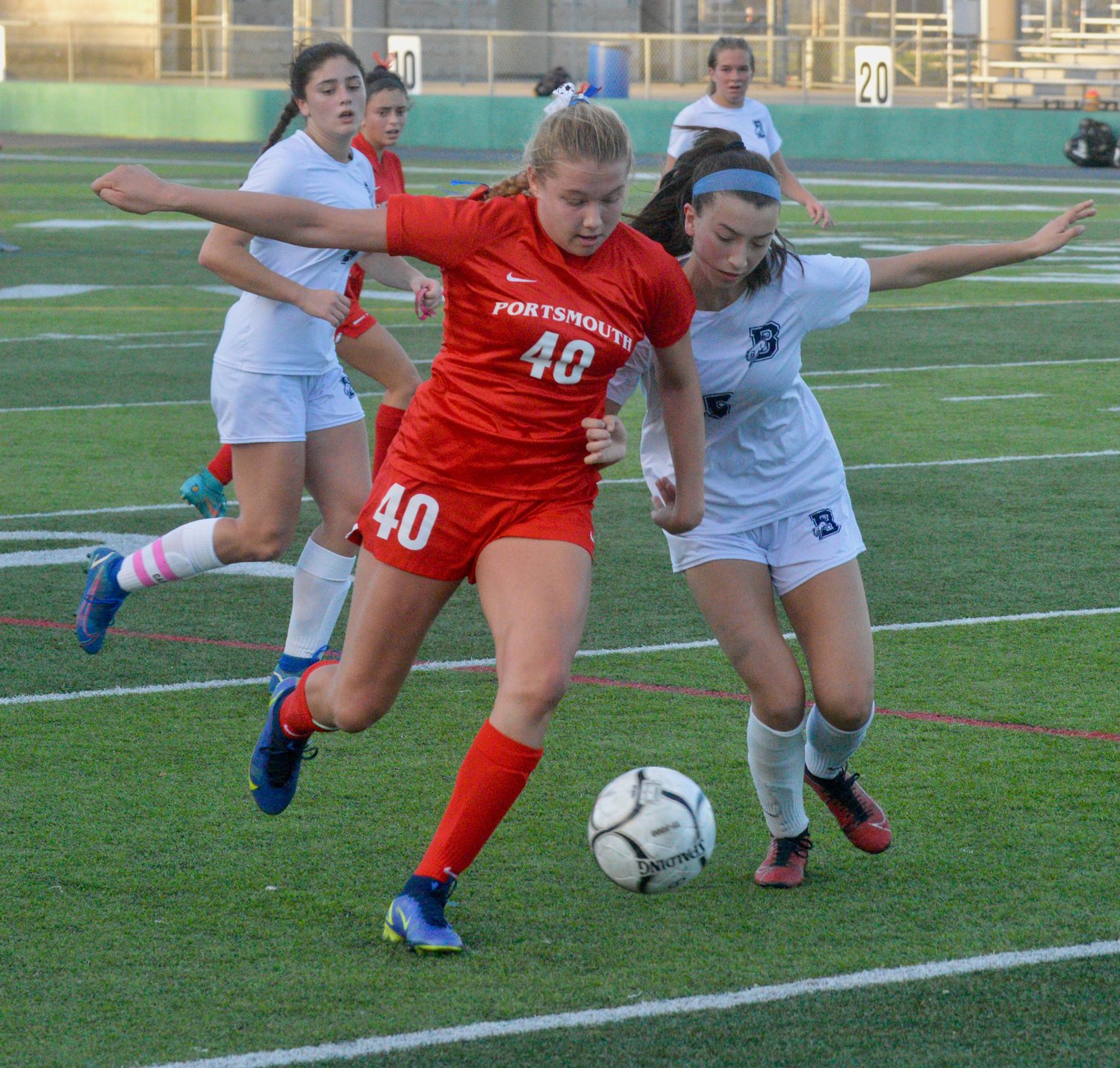Sophomore Mollyana McGuire fights for possession of the ball in the second half.