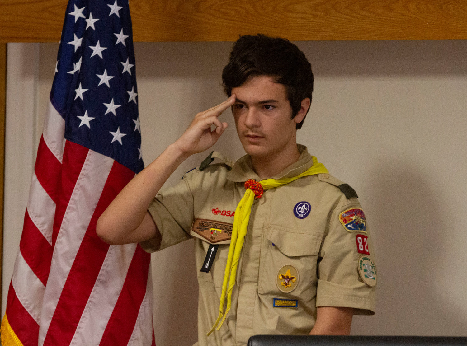 Boy Scout Gavin Courville salutes during the ceremony.