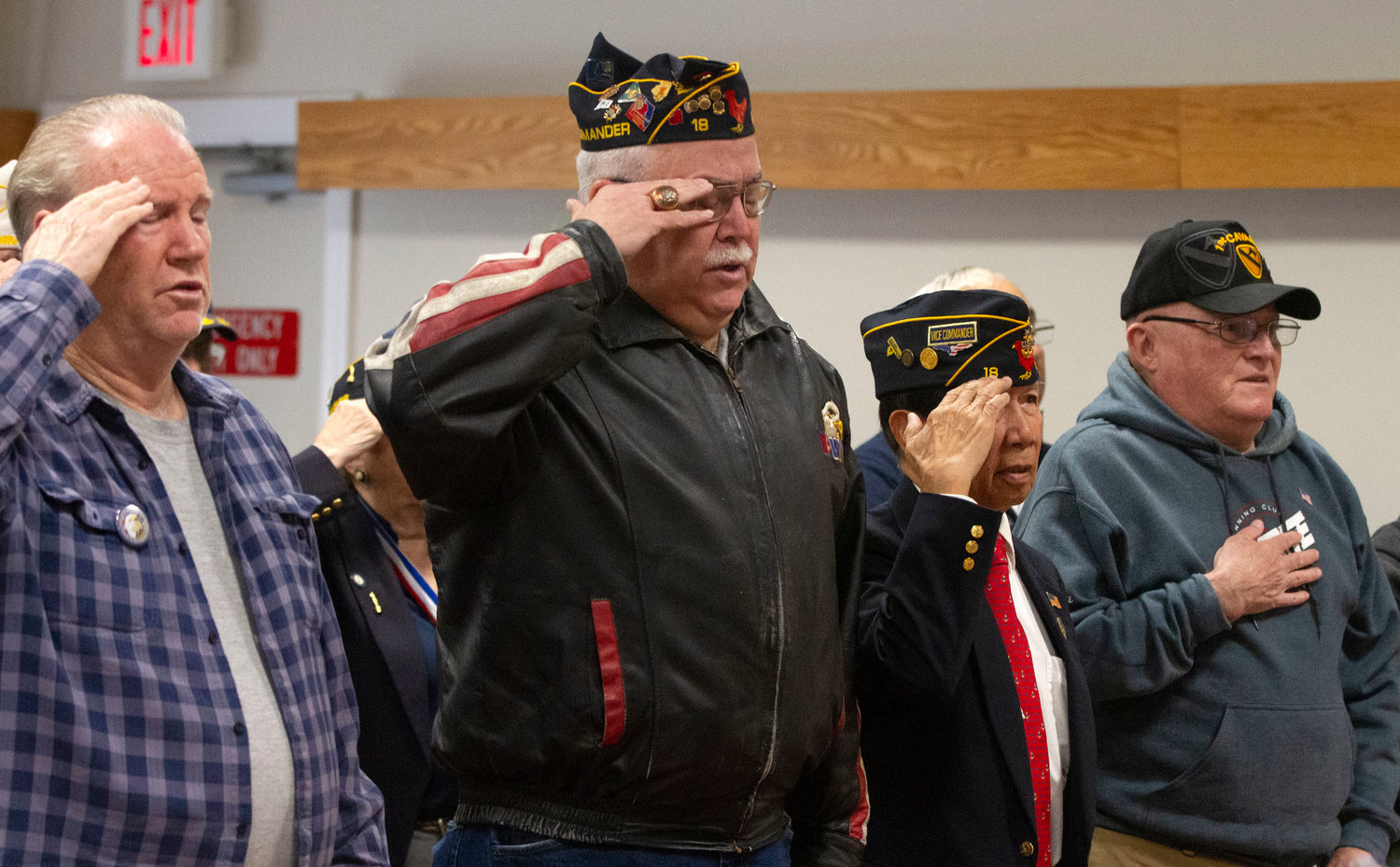 Veterans Donald Pfeiffer, Vincent D’Andrea, Tony Cercena and Jeff Fletcher (from left) salute the flag during the National Anthem.