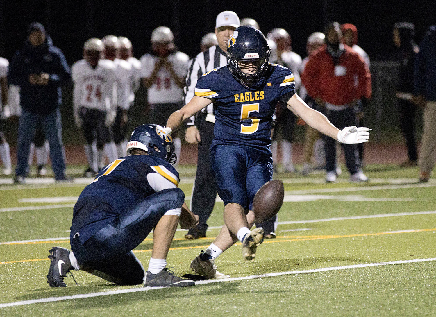 Will Hopkins kicks an extra point during the first half of the game against Mt. Pleasant.