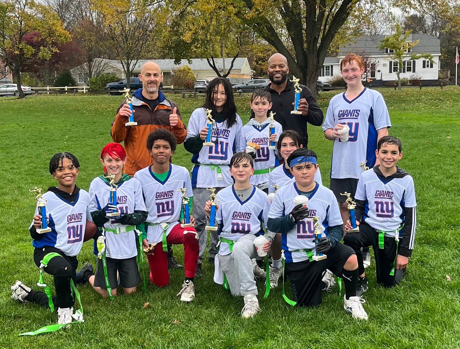 The 12U Giants celebrate the division championship on Sunday, after knocking off the Eagles and Dolphins.