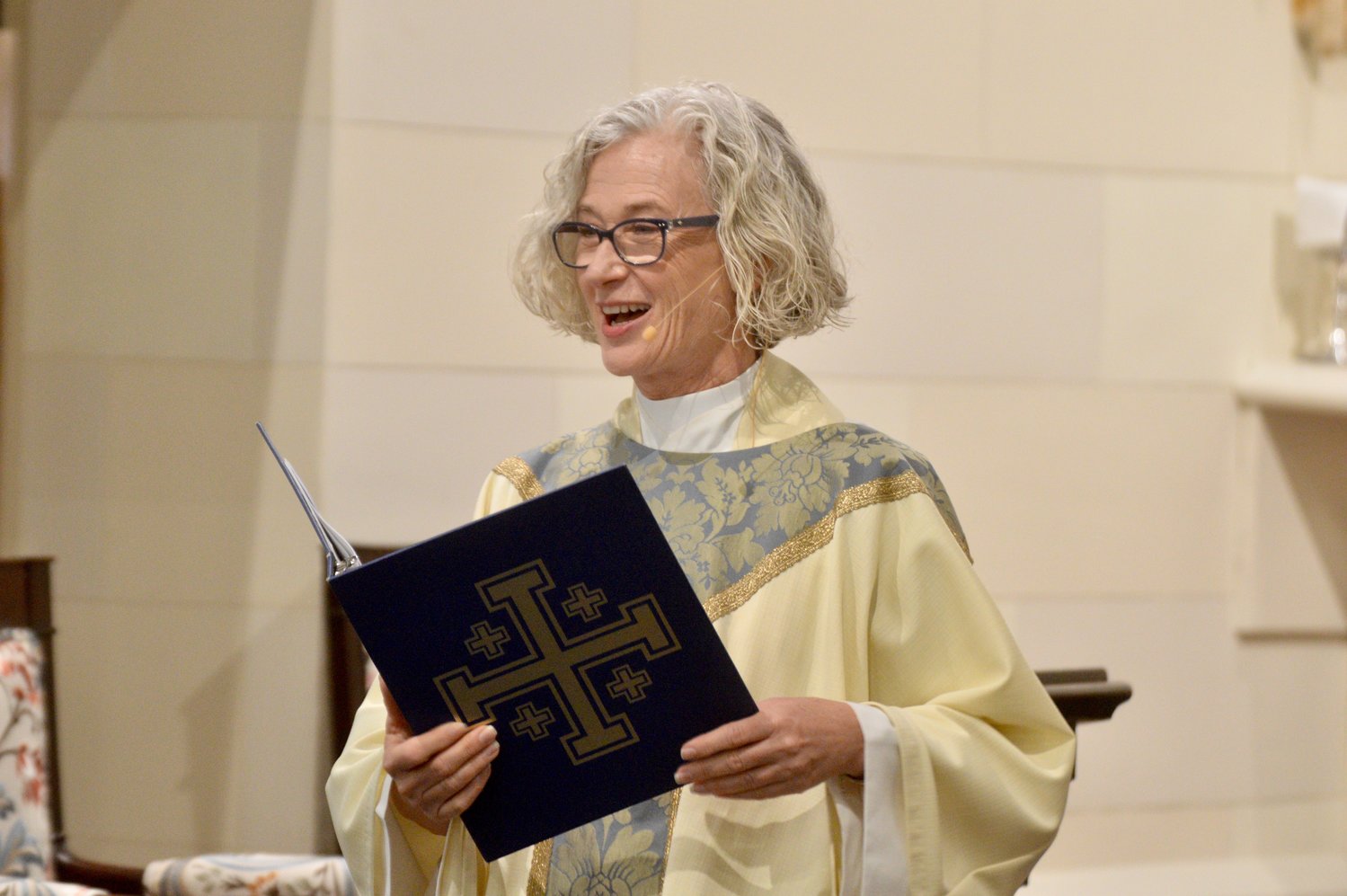 The Rev. Jennifer Pedrick, rector of St. Mary’s Episcopal Church, welcomes a full house of parishioners to the Nov. 13 morning service. “This beautiful house of prayer is a place to nourish and strengthen the living stone,” she said.