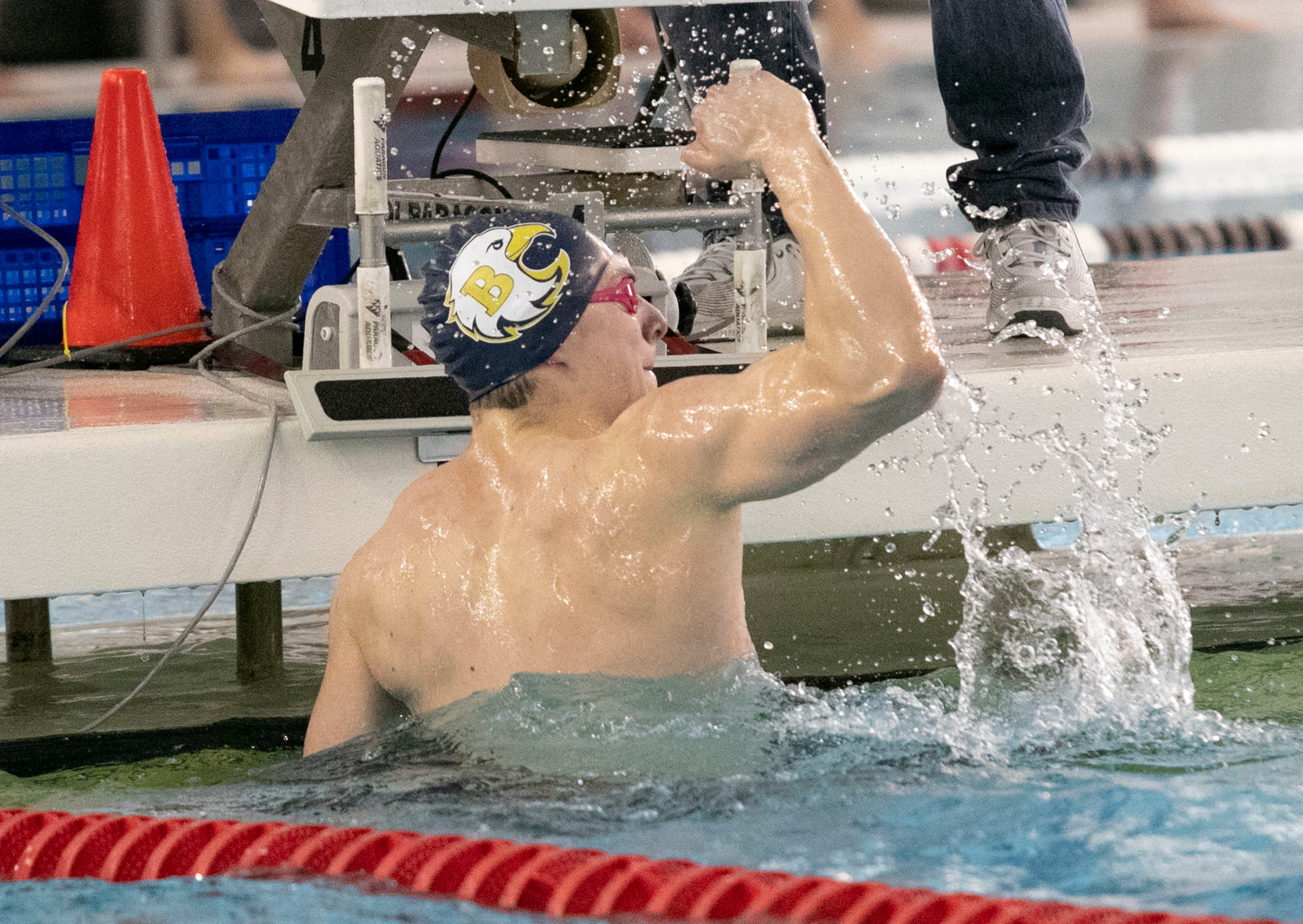 Barrington High School’s William McClelland pumps his fist in the air at last year’s state meet. McClelland, who recently committed to swim at Dartmouth College next year, set a state record in 50-freestyle last year.