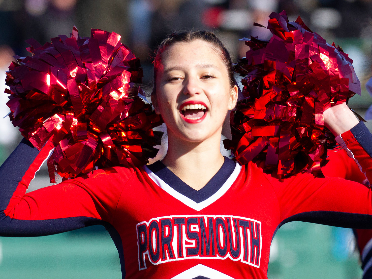 Emily Toner performs during halftime along with the other PHS cheerleaders.