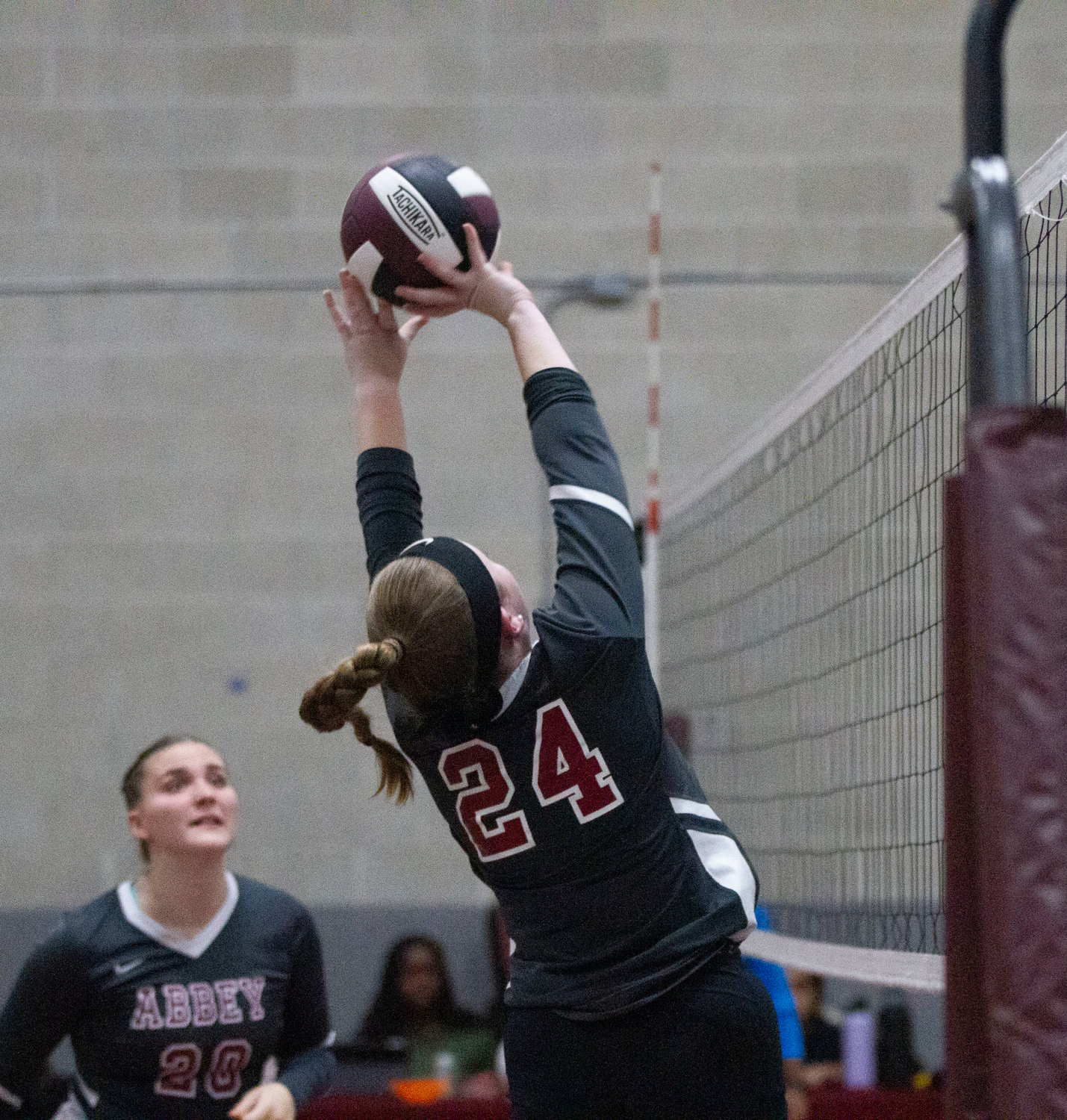 Bailey Howell of Westport volleys the ball back over the net during the first set.