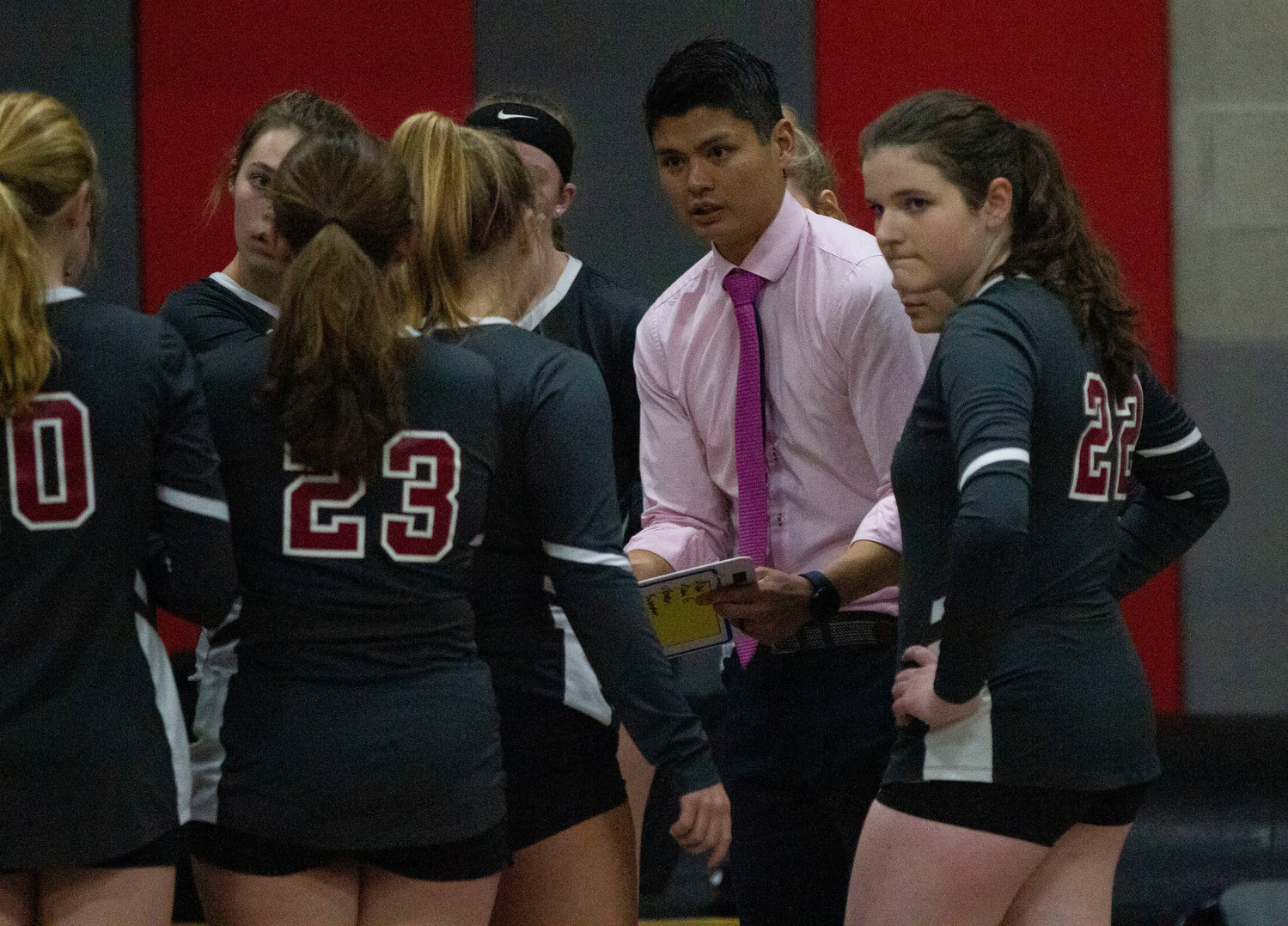 Head coach John Huynh speaks to the team during a timeout.