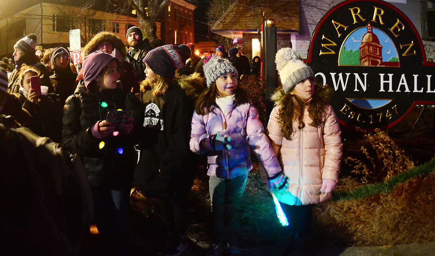 Children near Town Hall on Main Street excitedly await the lights to turn on during last year’s festival.