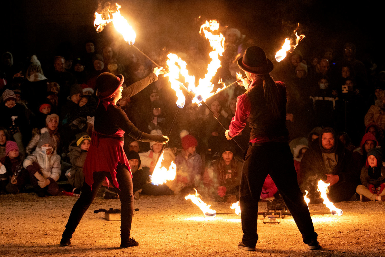 Fire spinners from last year’s Holiday Festival dazzle a crowd. Festival-goers can expect more of their impressive displays on Friday during two shows occurring at 5:15 and 6:15 at 39 Baker St.