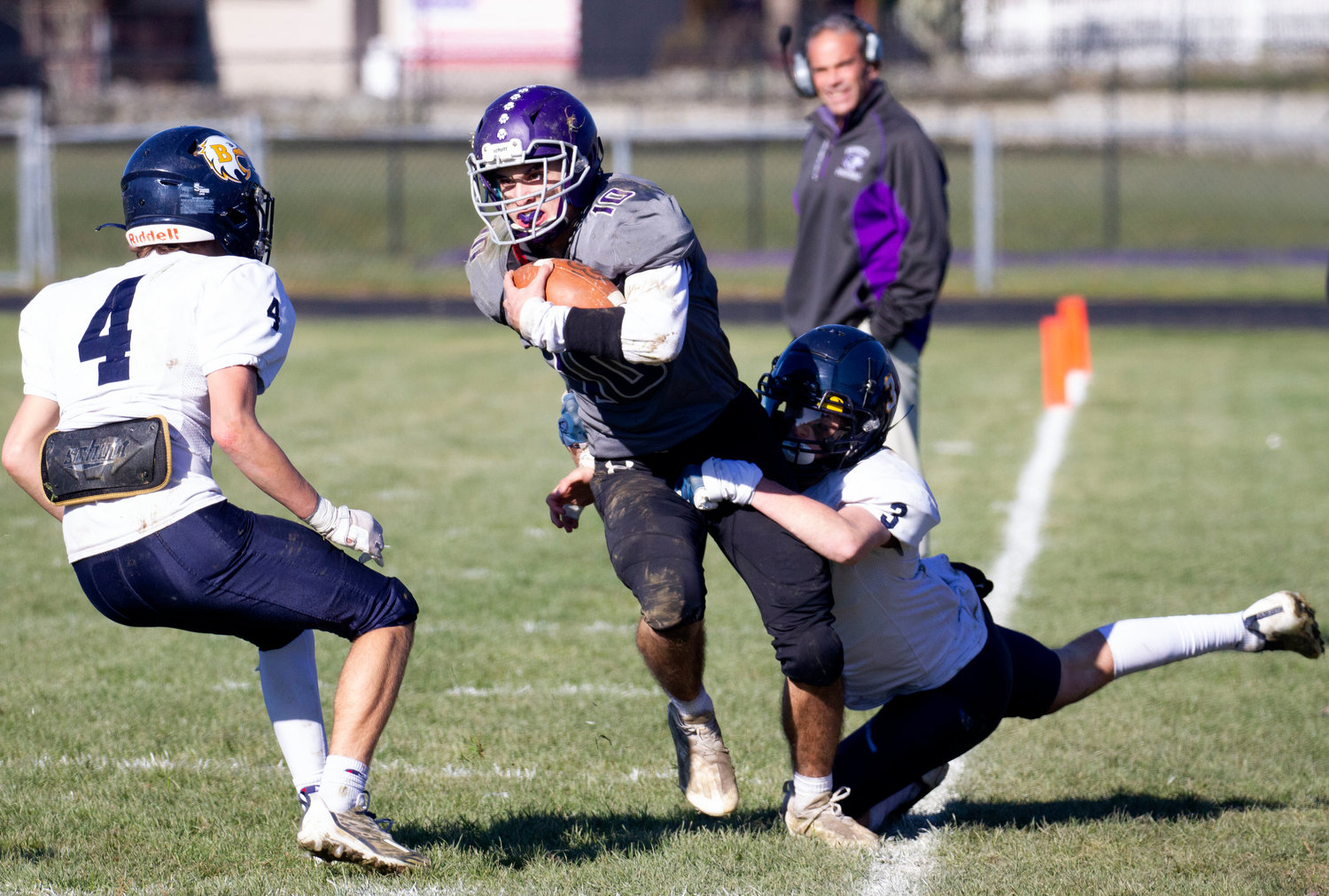 Running back Ben Colouro runs up the sidelines after breaking a tackle in the third quarter.