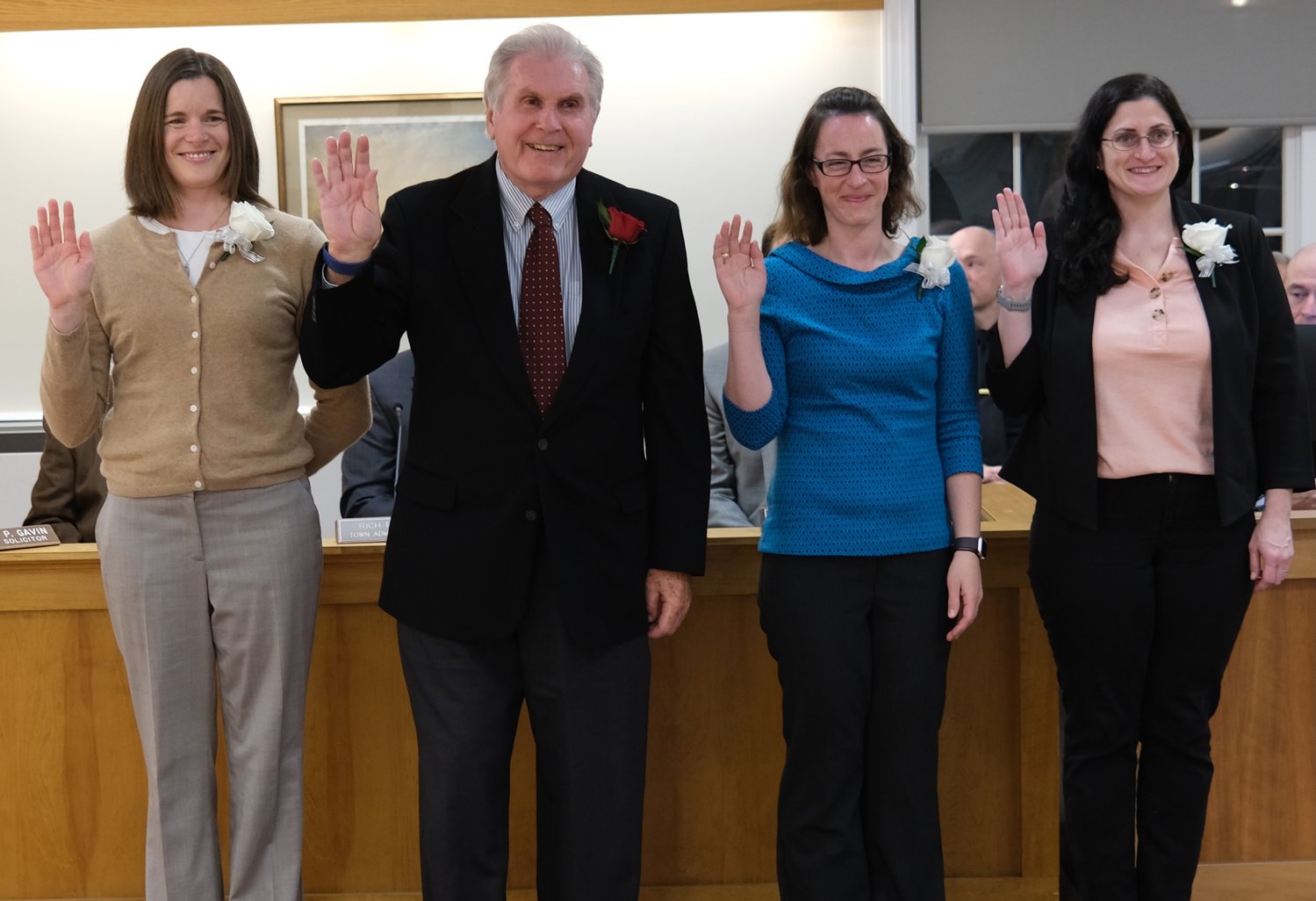 Emily Skeehan, Fred Faerber III, Isabelle Kelly, and Sondra Blank (from left) are sworn in as members of the Portsmouth School Committee by Gov. Daniel McKee during a ceremony at Town Hall Monday night.