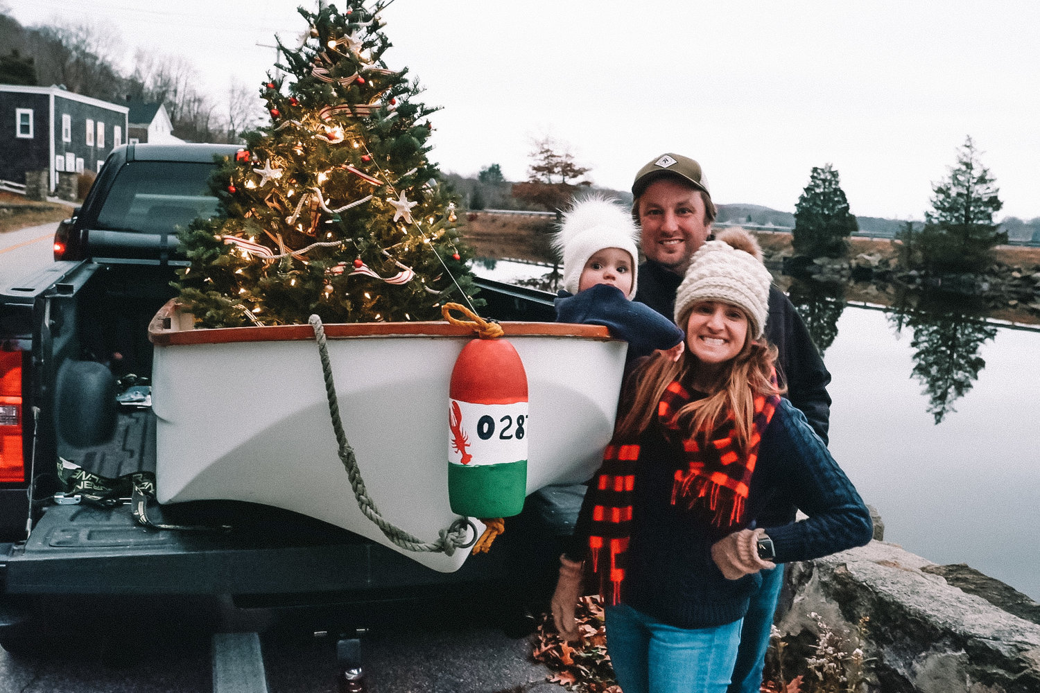 Caitlin and Paul Durand prepare to help friends launch Little Lady Christmas, as Isabel sits in the bow.