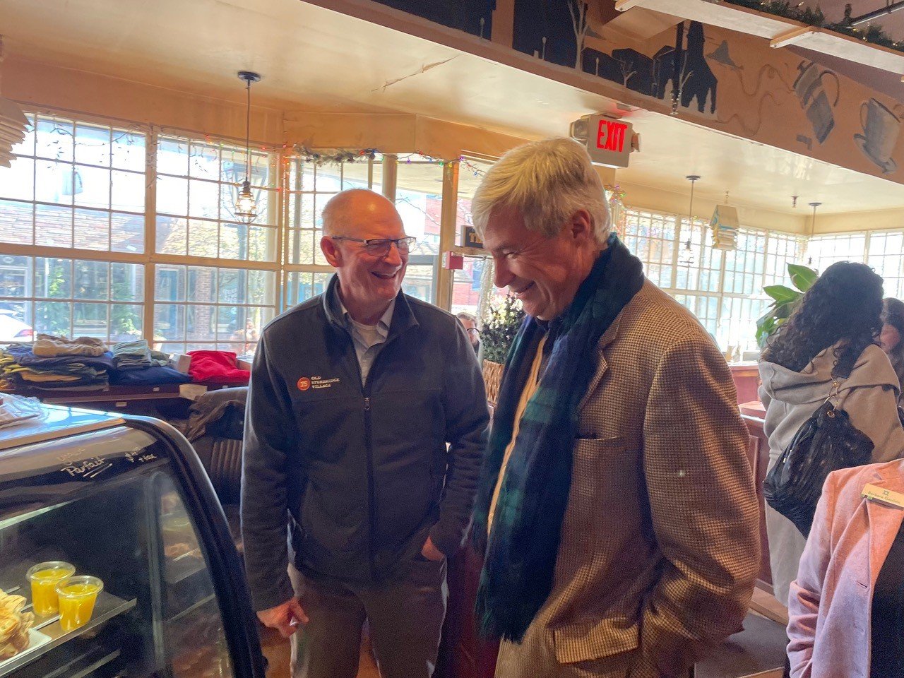 Senator Sheldon Whitehouse shares a laugh with Steve Lake, owner of the Coffee Depot, during a visit to the coffee shop last Tuesday morning.