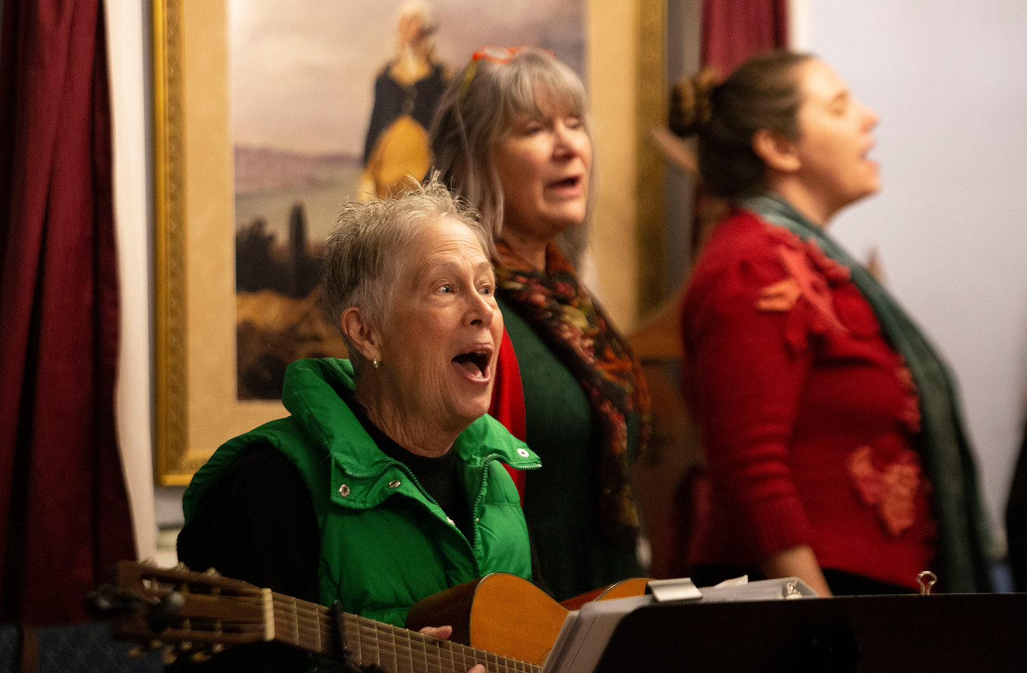 Mary Pardington and the group Heaven and Nature sing Christmas carols in the Masonic Lodge. 