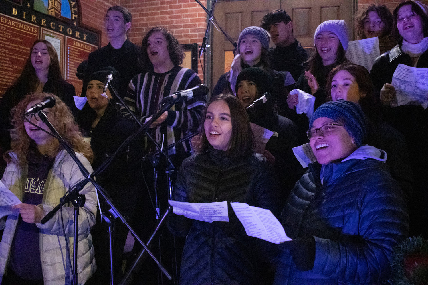 The Mt. Hope choral ensemble sing Christmas carols on the town hall steps before Santa and friends turn on the lights. 