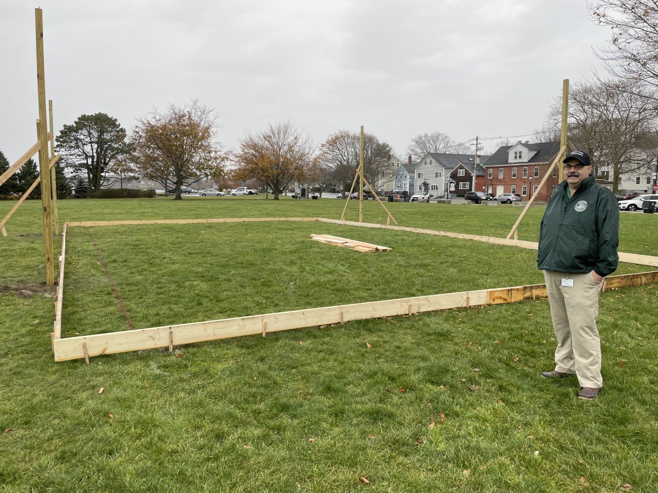 Bristol Parks and Recreation Director Warren Rensehausen stands beside the framing for the new skating rink at Independence Park.