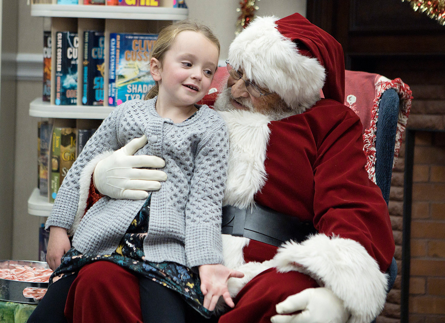 Addilyn Russo, 4, recites her long list of wishes — it included “a real kitten, a shark, a dollhouse” and more — to Santa.