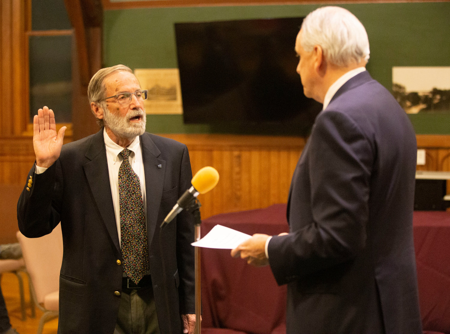 Richard Staples (left) is sworn in as Barrington Town Moderator.