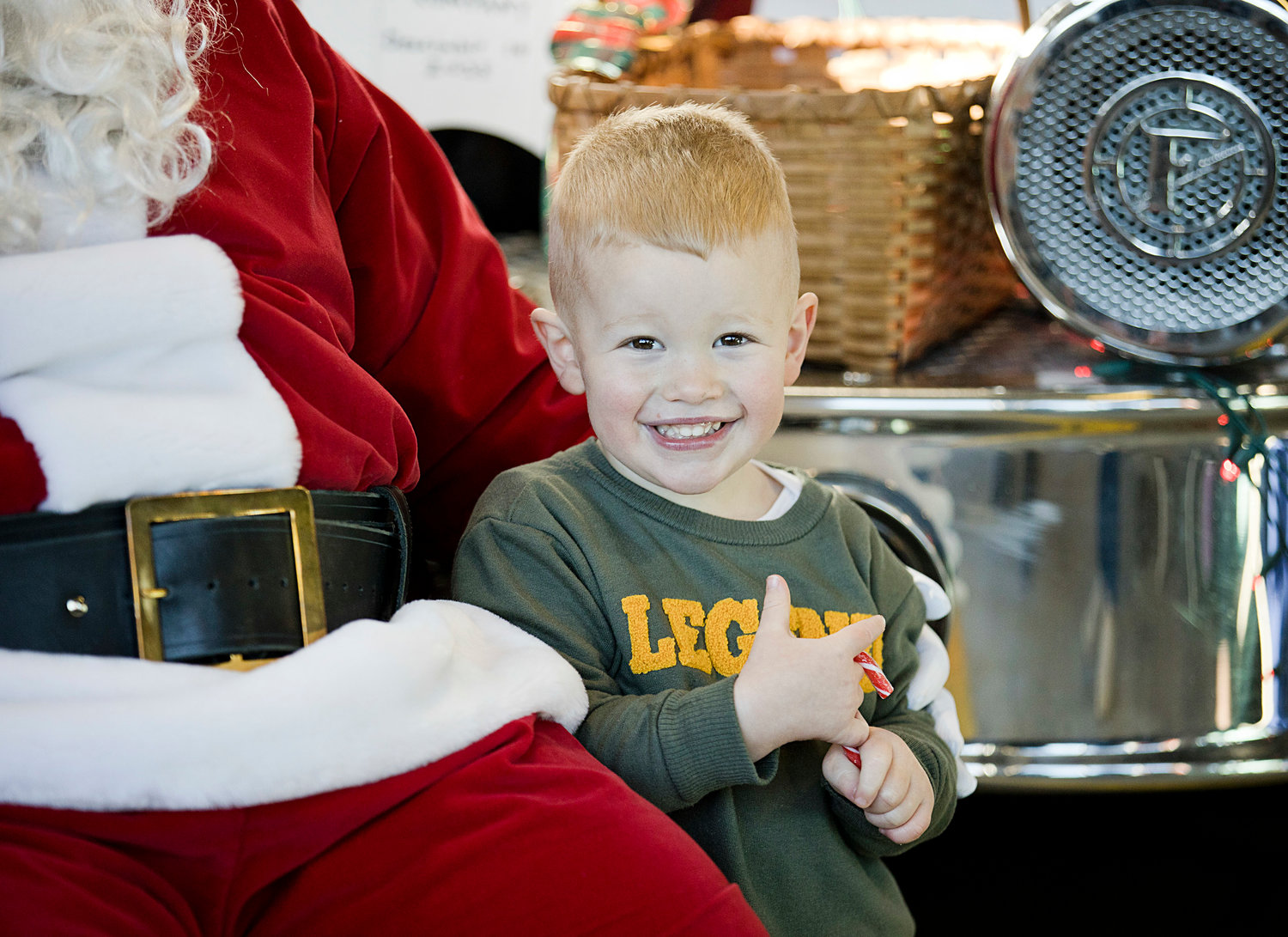 Ryan Barnowski beams with excitement after receiving a candy cane from Santa at Central Fire Company's "Breakfast with Santa" event, Sunday.
