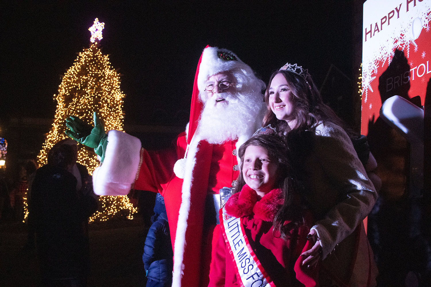 Santa is joined by Little Miss Fourth of July, Alana Crowell, and Miss Fourth of July, Gwenyth Tucker, as the town’s new tree is illuminated and the celebration begins.