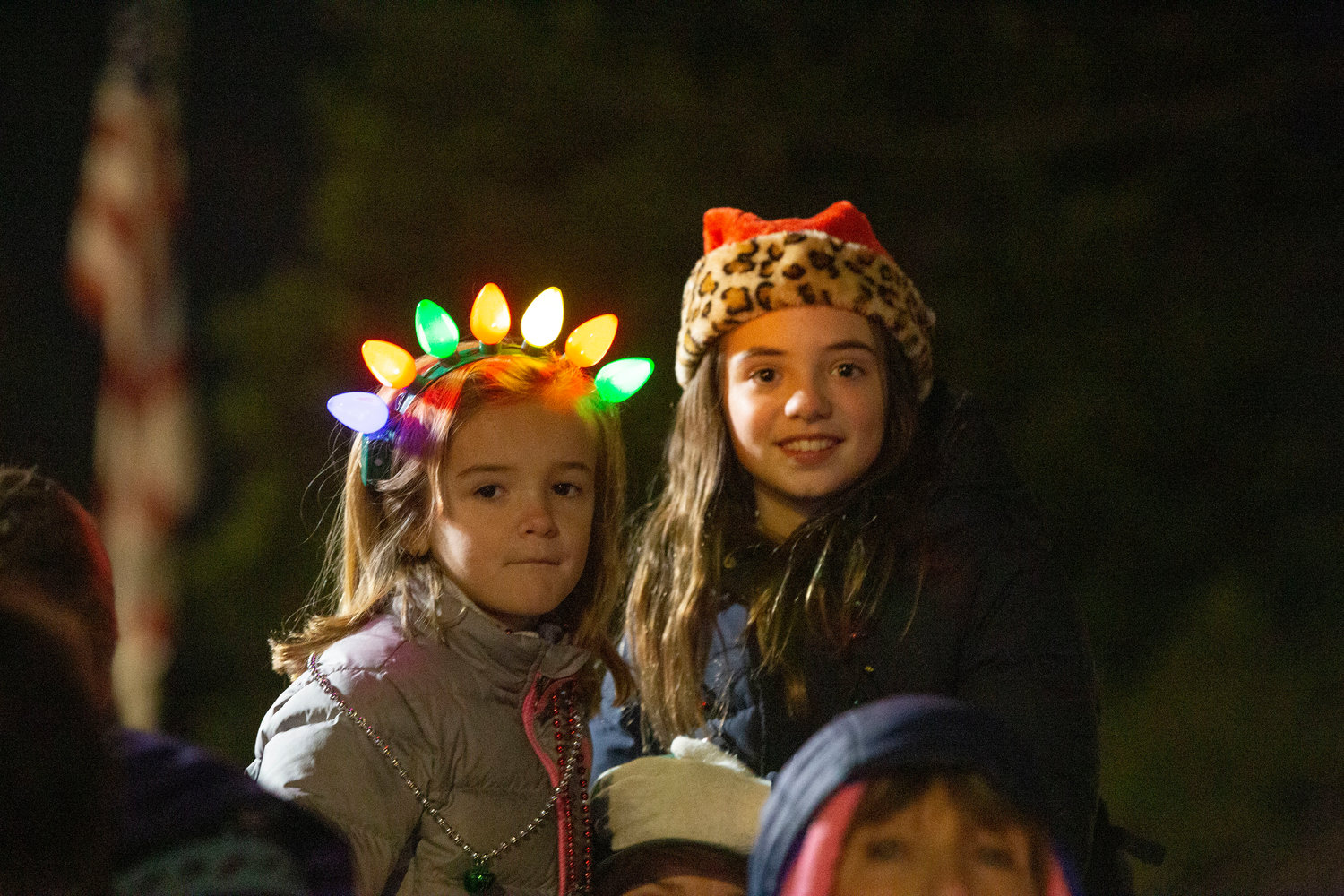 Festive headgear was seen throughout the crowd, as evidenced by these two girls enjoying the show.