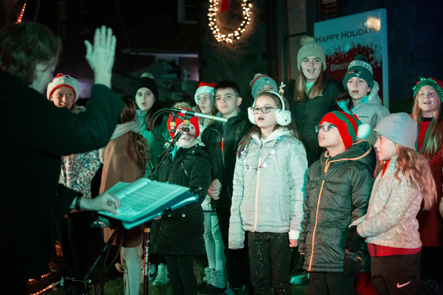 Students sing Christmas carols.