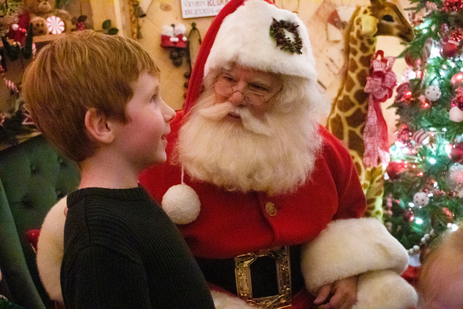 Noah Gill, 4, tells Santa what he’d like for Christmas. 