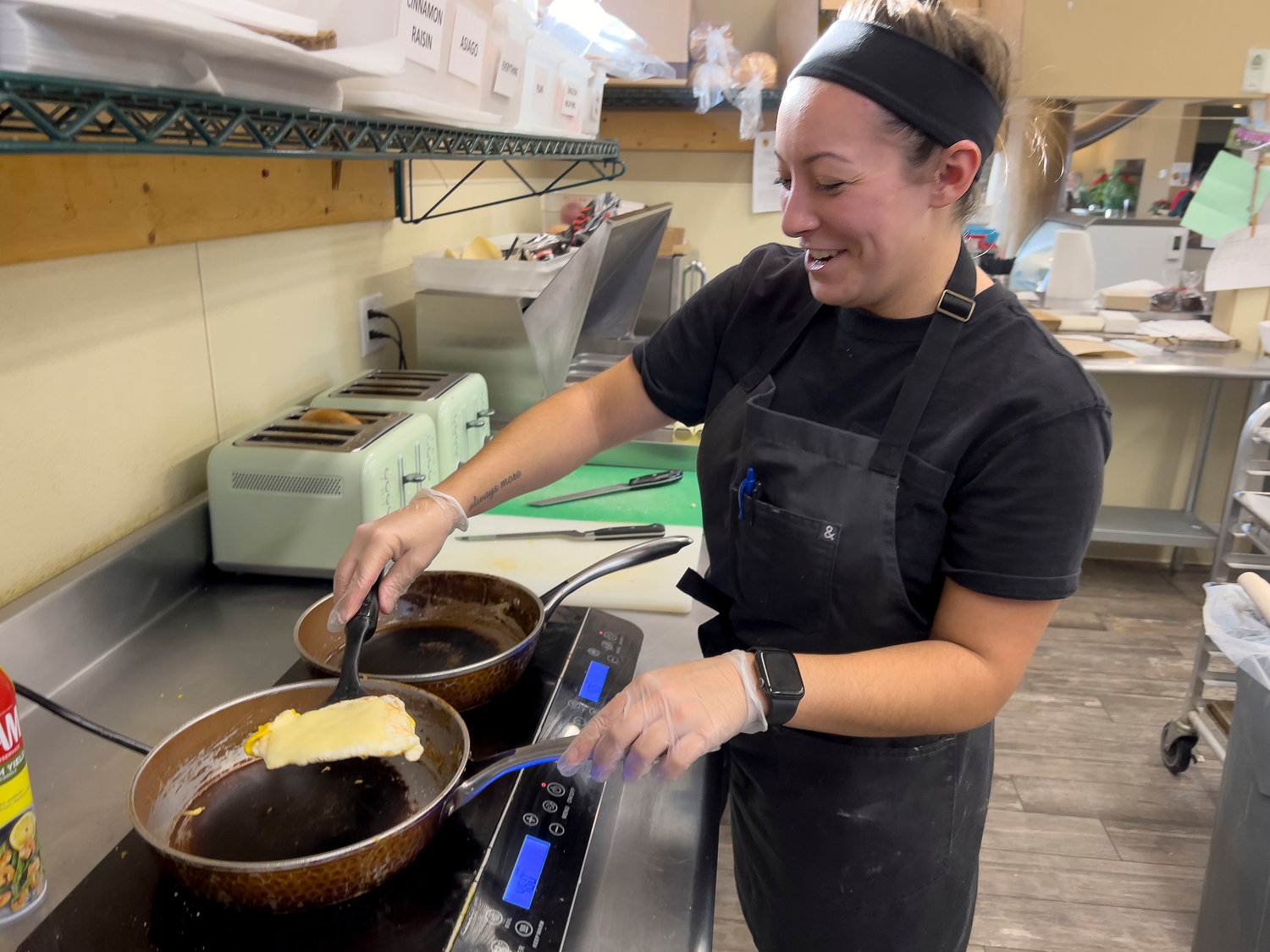 New pastry chef Jackie Arruda works in the kitchen at Thriving Tree Coffee House on Monday.
