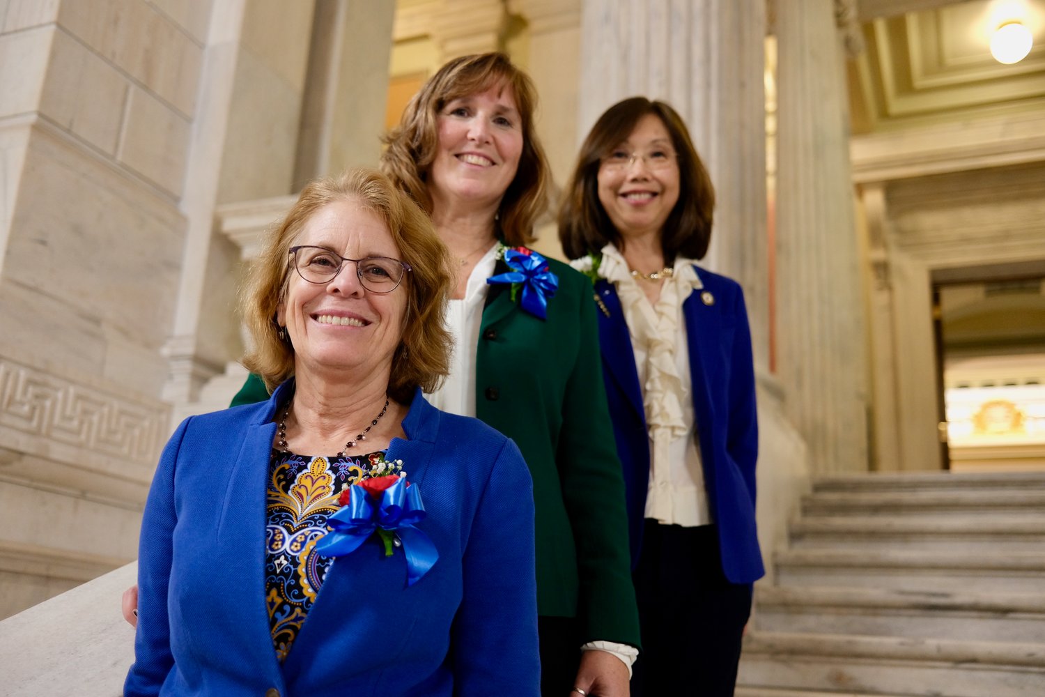 Rep. Terri Cortvriend, Rep. Michelle McGaw, and Sen. Linda Ujifusa (front to back), all of Portsmouth, pose outside the Senate Chamber at the Rhode Island State House, shortly after swearing-in ceremonies Tuesday night. They’re making history for being the town’s first-ever all-female General Assembly delegation.