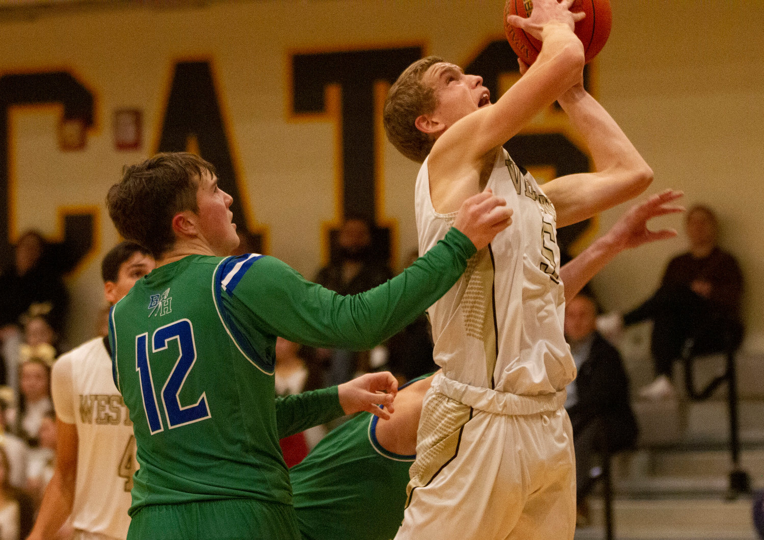 Coltrane McGonigle is fouled while putting back a rebound in the second half.