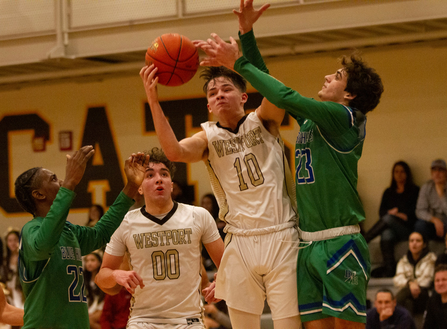 Max Morotti (left) looks on as Cam Leary comes down with a rebound.