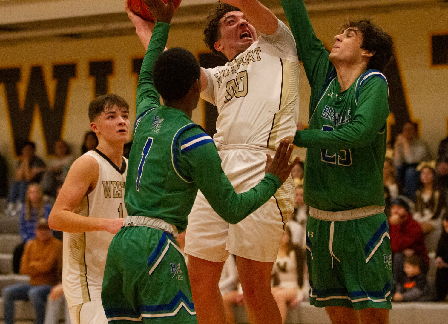 Max Morotti fights his way to the basket after grabbing an offensive rebound.