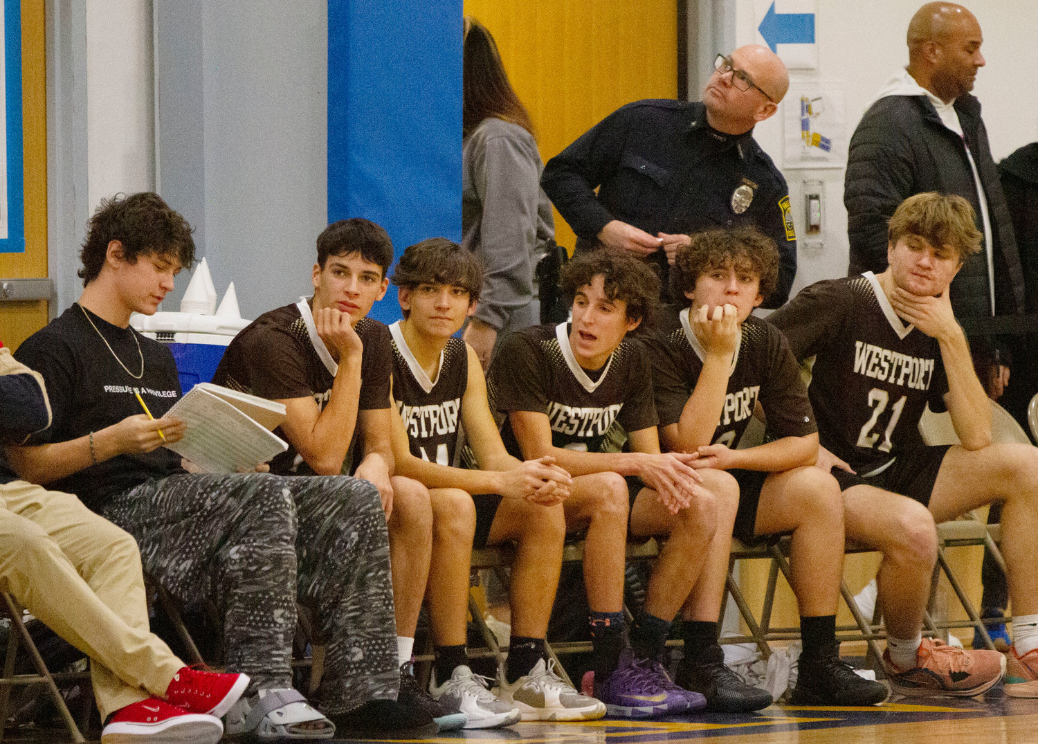 Injured Owen Friedrichson (left) keeps stats on the bench, with Owen Boudria, Ben Boudria, Chris Duarte and others.