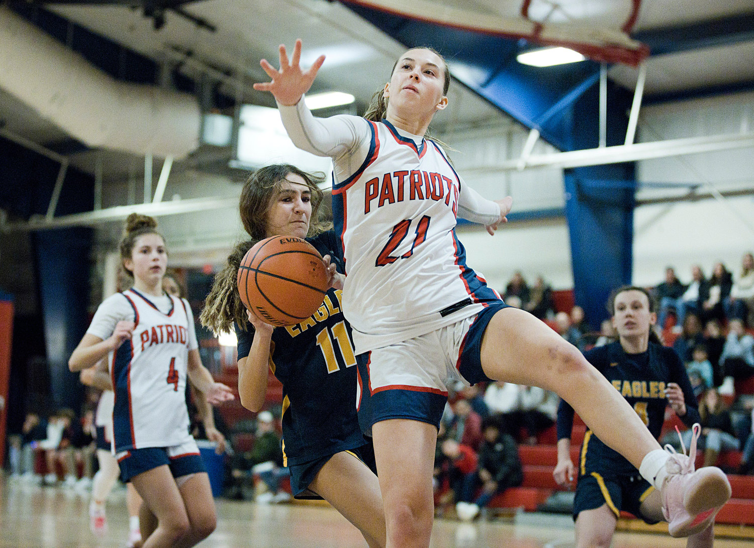 Ava Hackley leaps in front of Barrington’s Olivia Morrissette, preventing her from shooting.