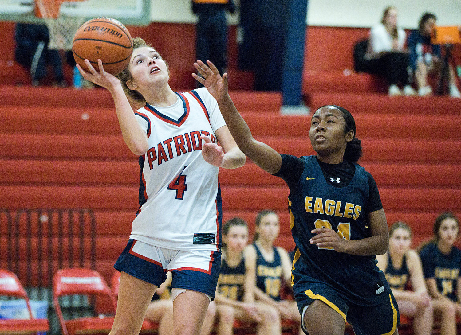 Portsmouth High’s Ava Moore is pressured by Barrington defender, Janaya Prince Baquero, while sending the ball up for a shot in Monday’s home game.