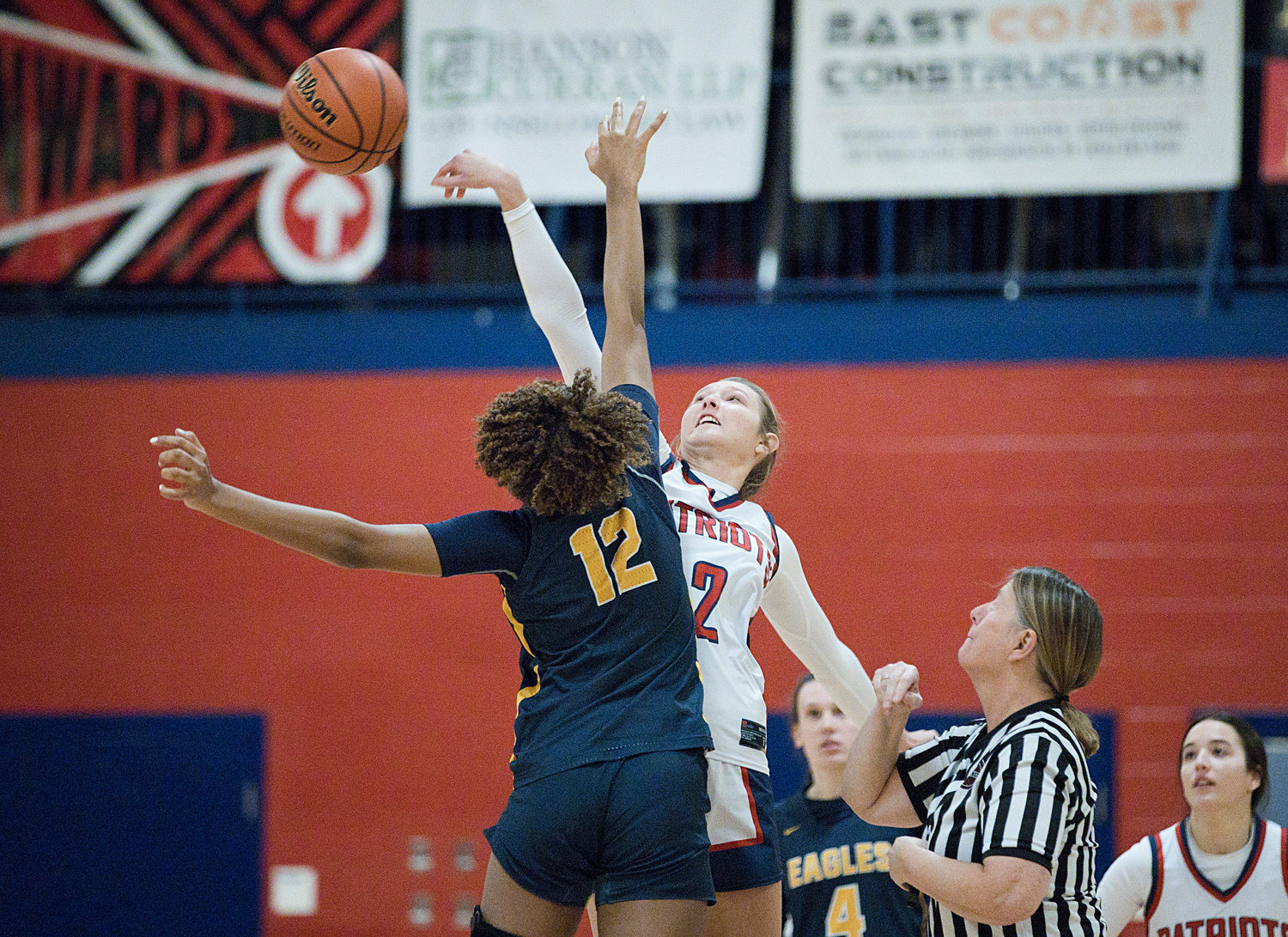 Morgan Casey tips off against Barrington’s Lindsey Lemay at the start of Monday’s game.