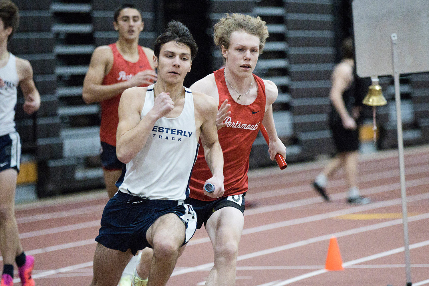 Lukas Huffman races past a Westerly opponent while running the final leg of the 4x200 in which Portsmouth finished first.