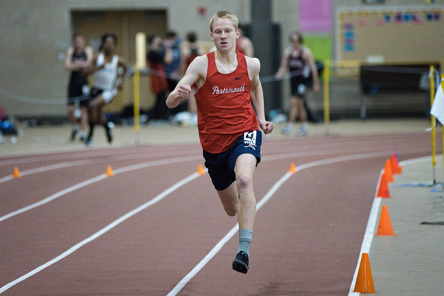 Nate DeConto speeds around the track while competing in the 300-meter race.
