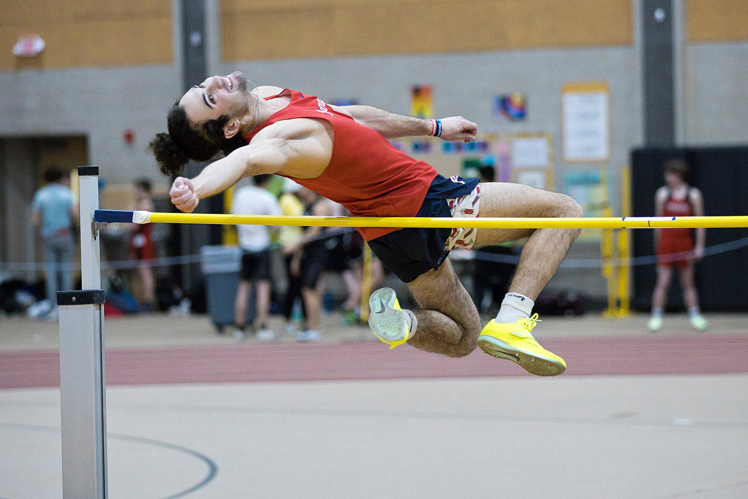 Nikolai Loyola competes in the high jump during Friday’s meet.