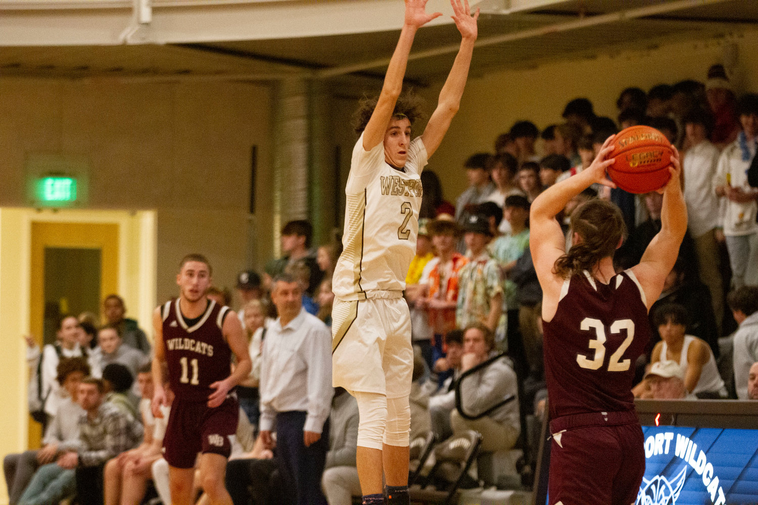 Ben Boudria leaps into the air to block a West Bridgewater pass during a full court press.