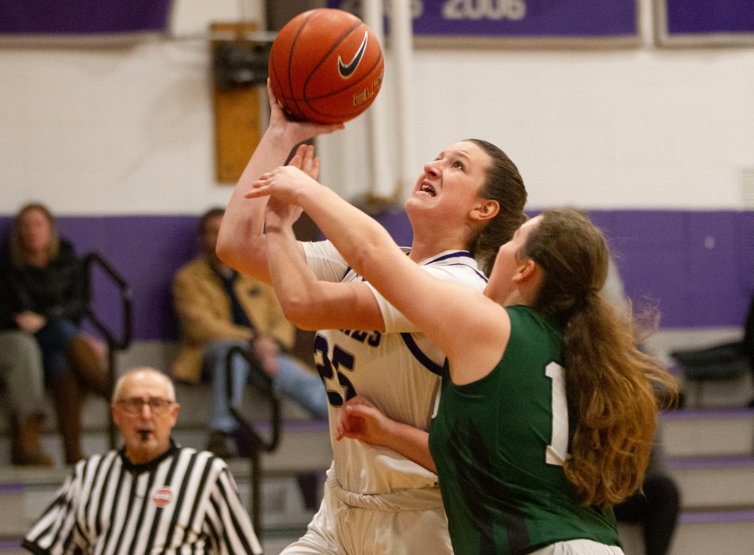 Emily Moran drives to the basket during the Huskies' loss to Chariho.