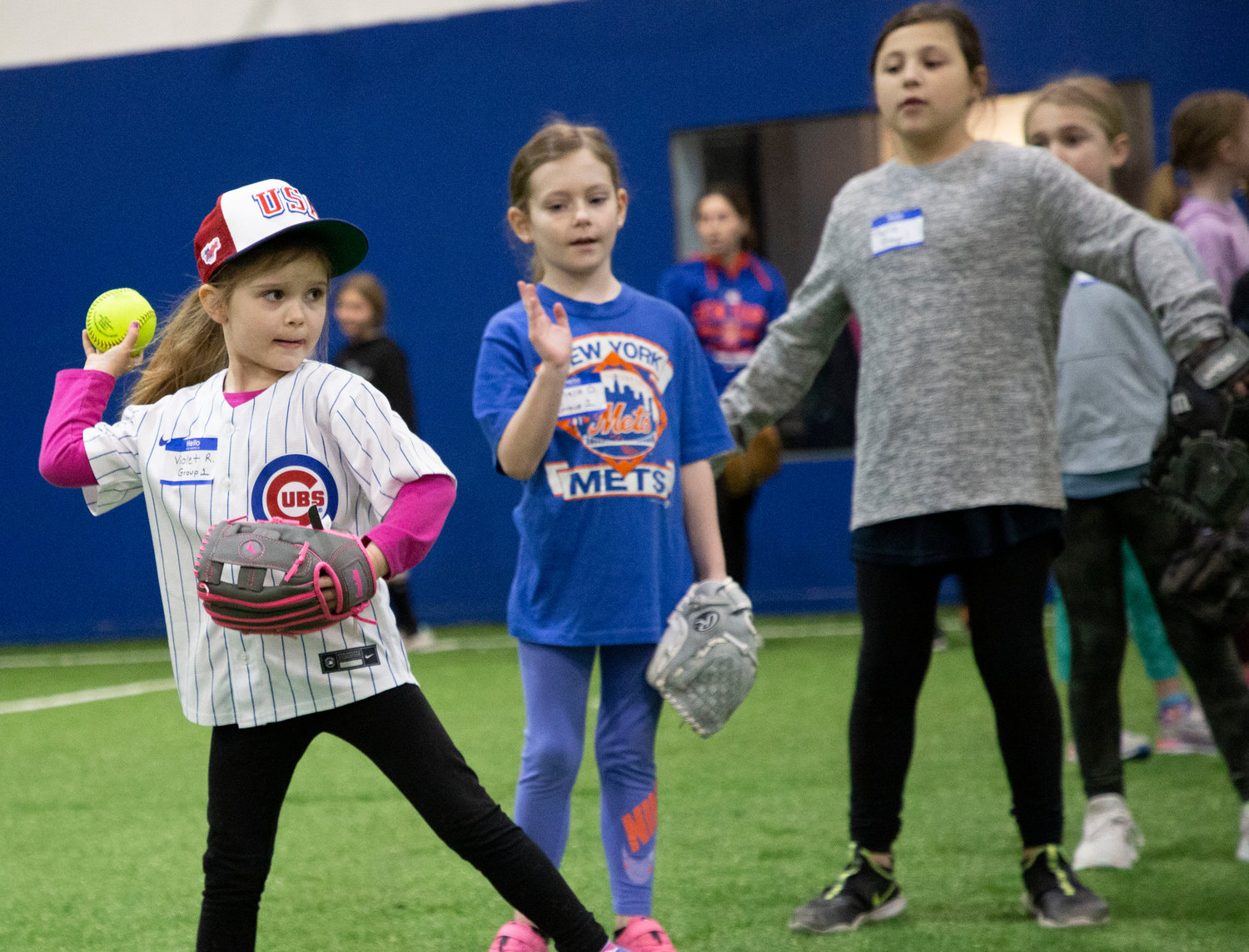 Violet Robertson gets ready to throw the ball during a special skills clinic held by Barrington Little League and NY Mets pitcher David Robertson.