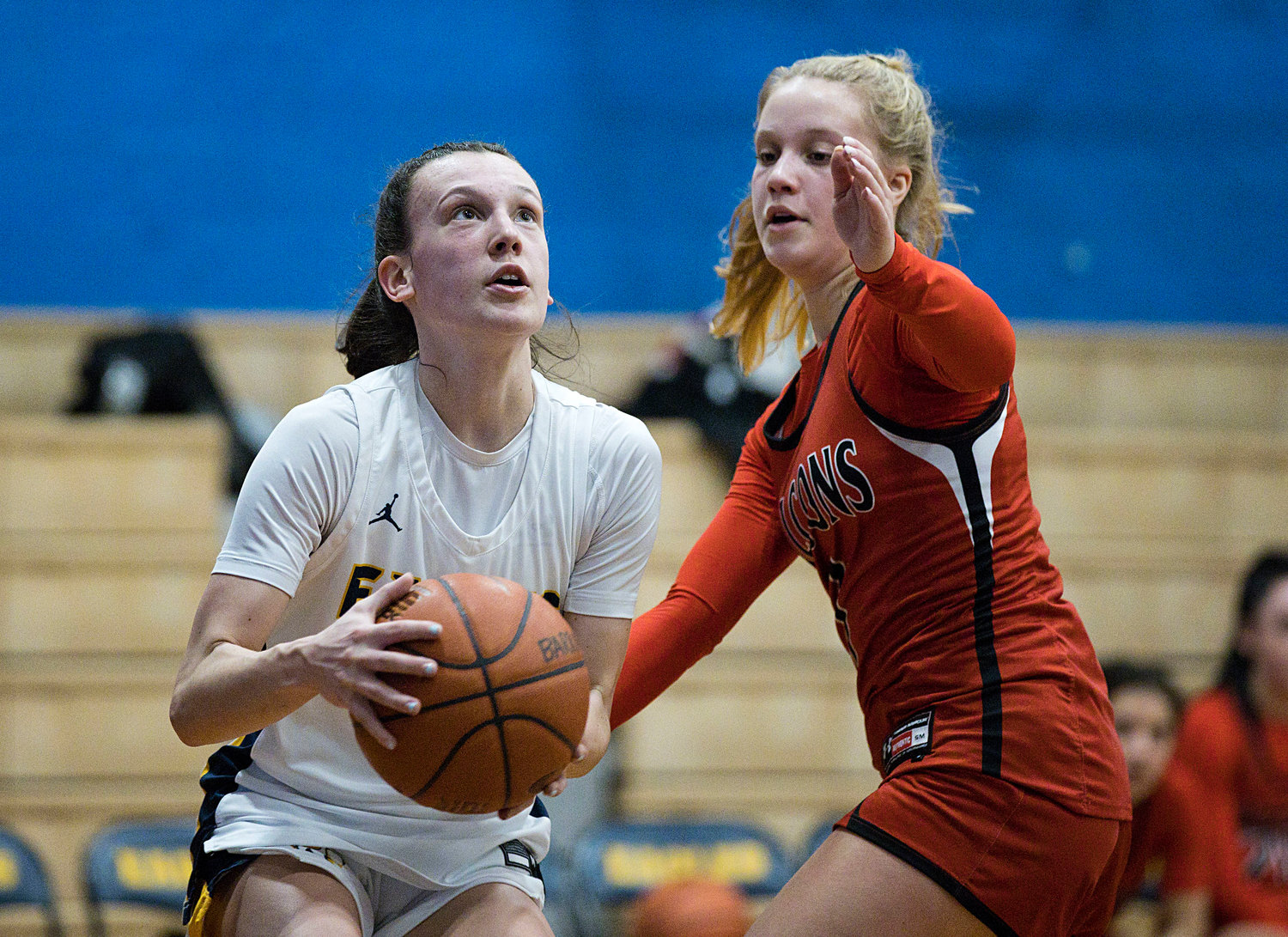Maddie Gill considers a shot while guarded closely by a Cranston West opponent.
