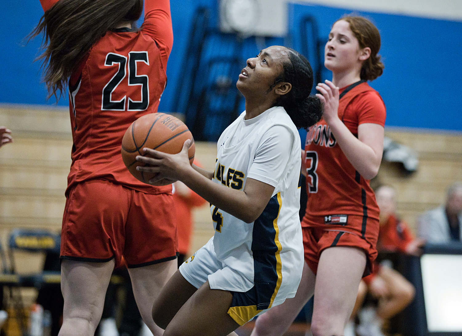 Janaya Prince-Baquero weaves past a pair of Cranston West defenders en route to a first-half basket.