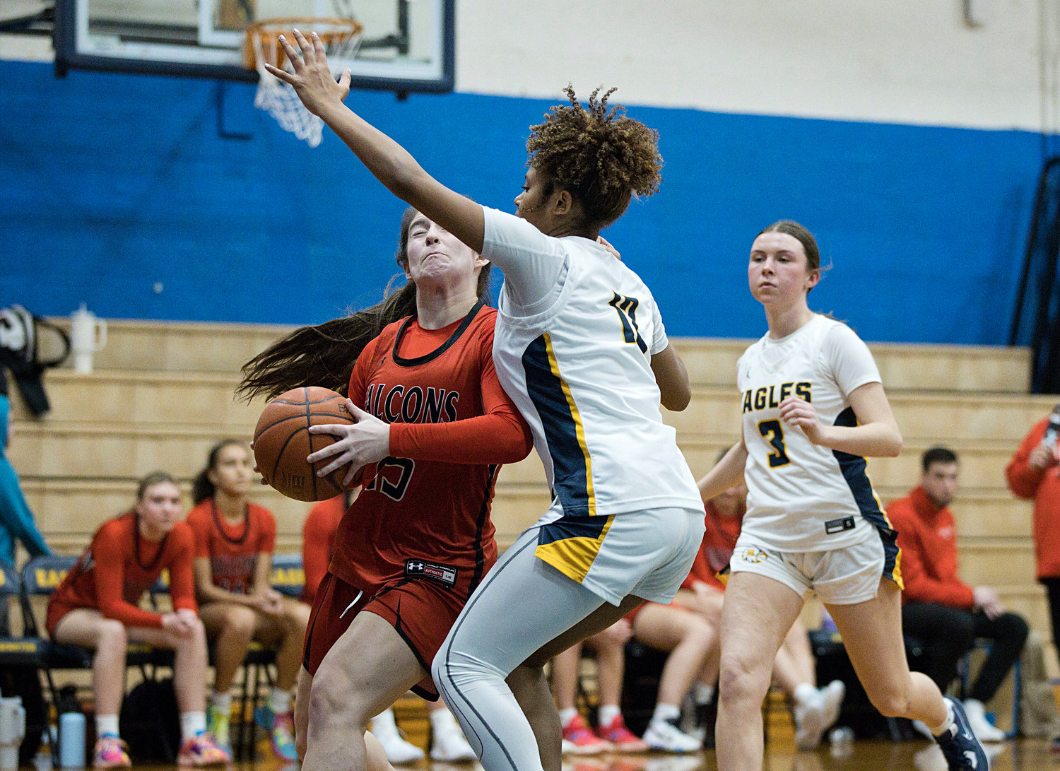 Lindsey Lemay guards a Cranston West opponent under the hoop.