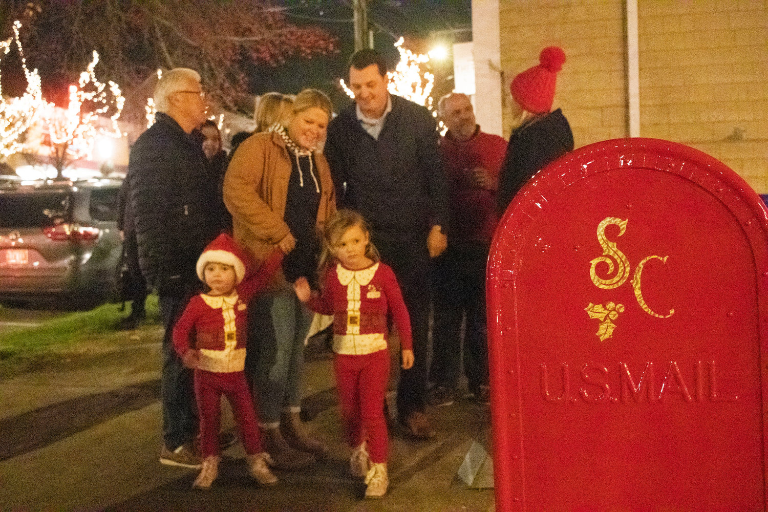 People line up near the house’s special mailbox for a chance to see Santa.