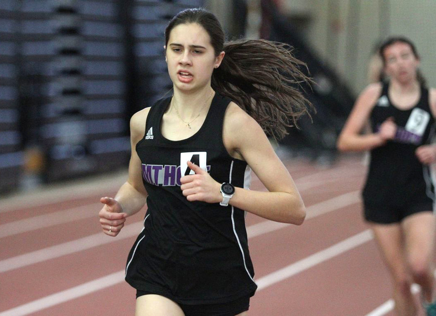 Freshman Jessica Deal running in the 1000 meter run, scored 26 points for Mt. Hope by placing first in the 3000 meter run and second in the 1000 and 1500 meter runs.