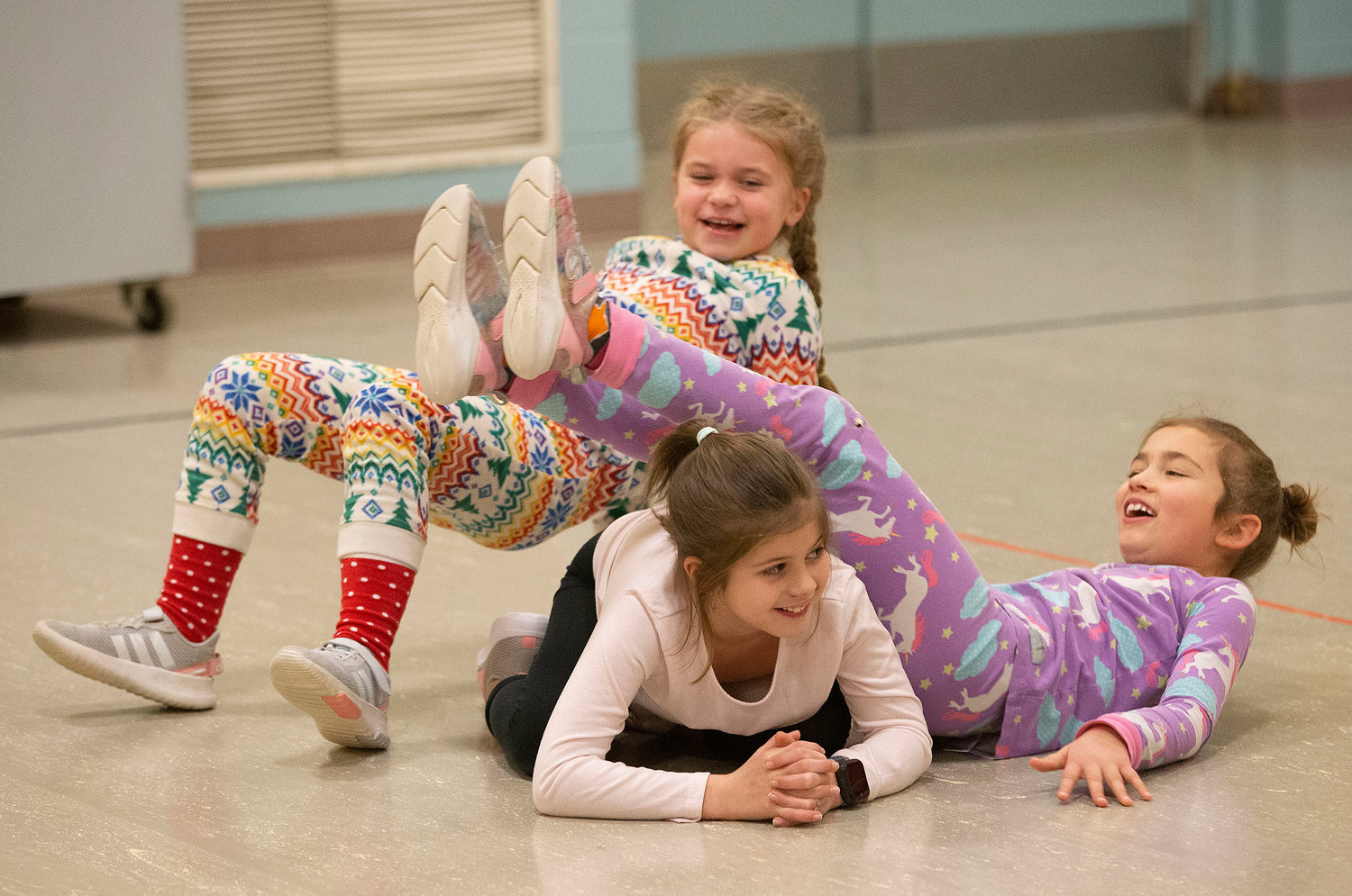 Hope McKenzie, Sofia Clarizio and McKenna O'Malley have a mishap while performing a shape.
