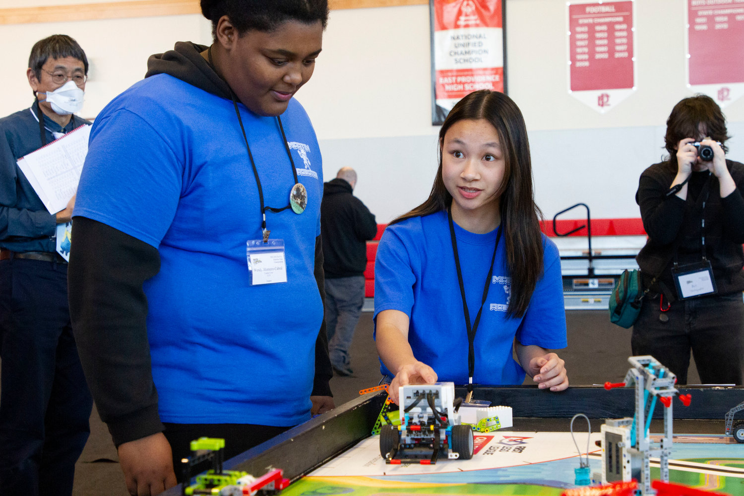 Wendy Monteiro-Cabral (left) and Caitlin Chiong set up the bot for competition.