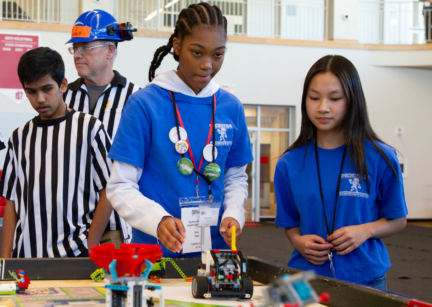Martin students Anai Greer (left) and Caitlin Chiong operate their robot.