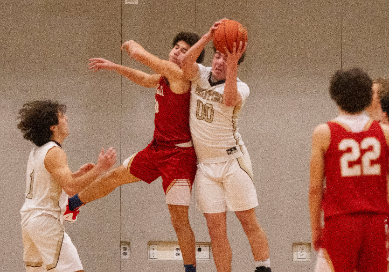 Max Morotti grabs a defensive rebound during the game. Morotti scored 17 points and brought down 8 rebounds during the game.